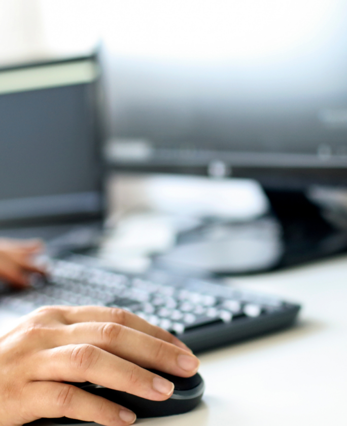 An individual working remotely at their home desk